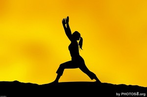 young_woman_yoga_silhouette_in_yellow_sunset_sjpg11667